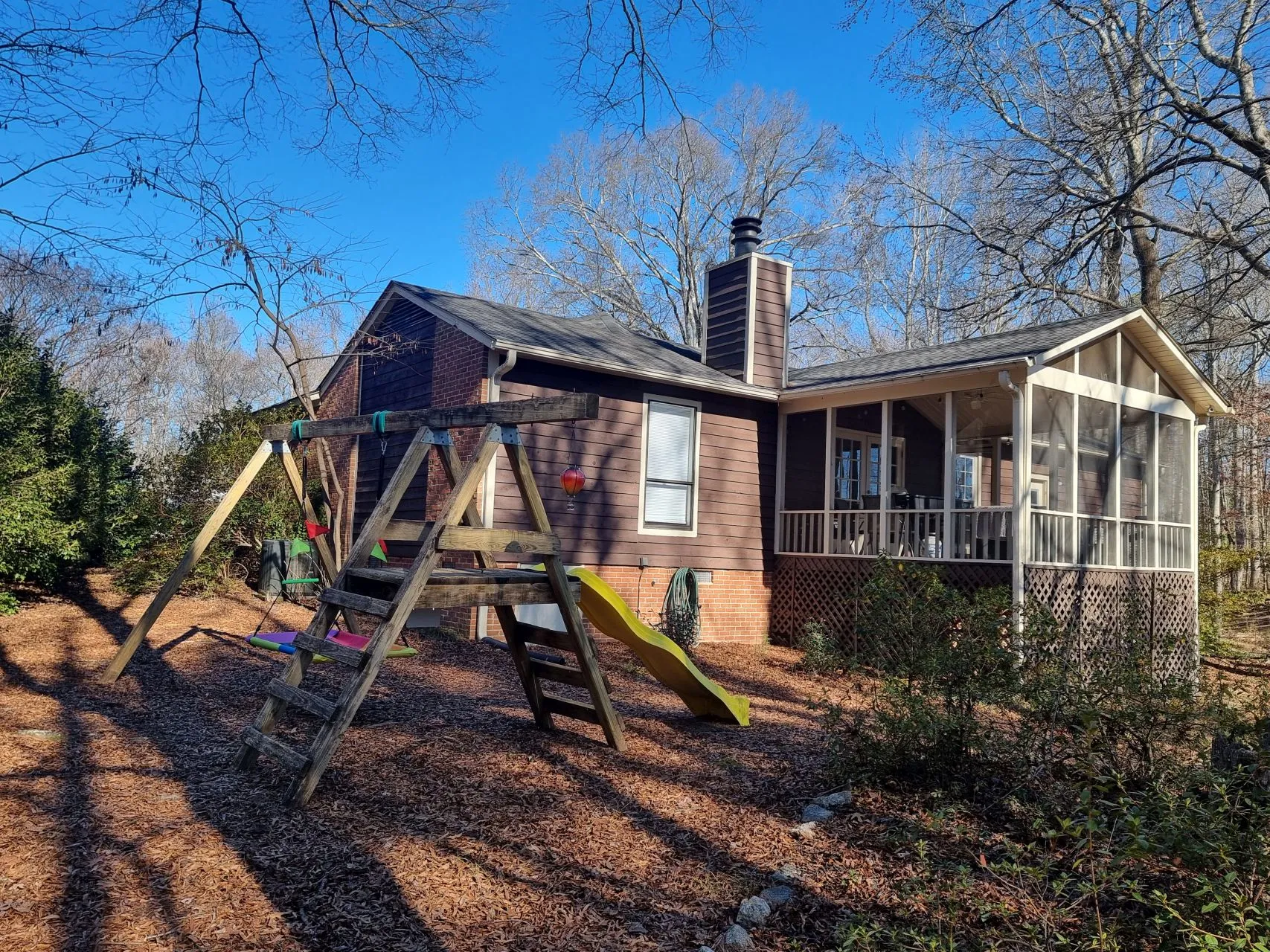 Backyard with swing set and slide