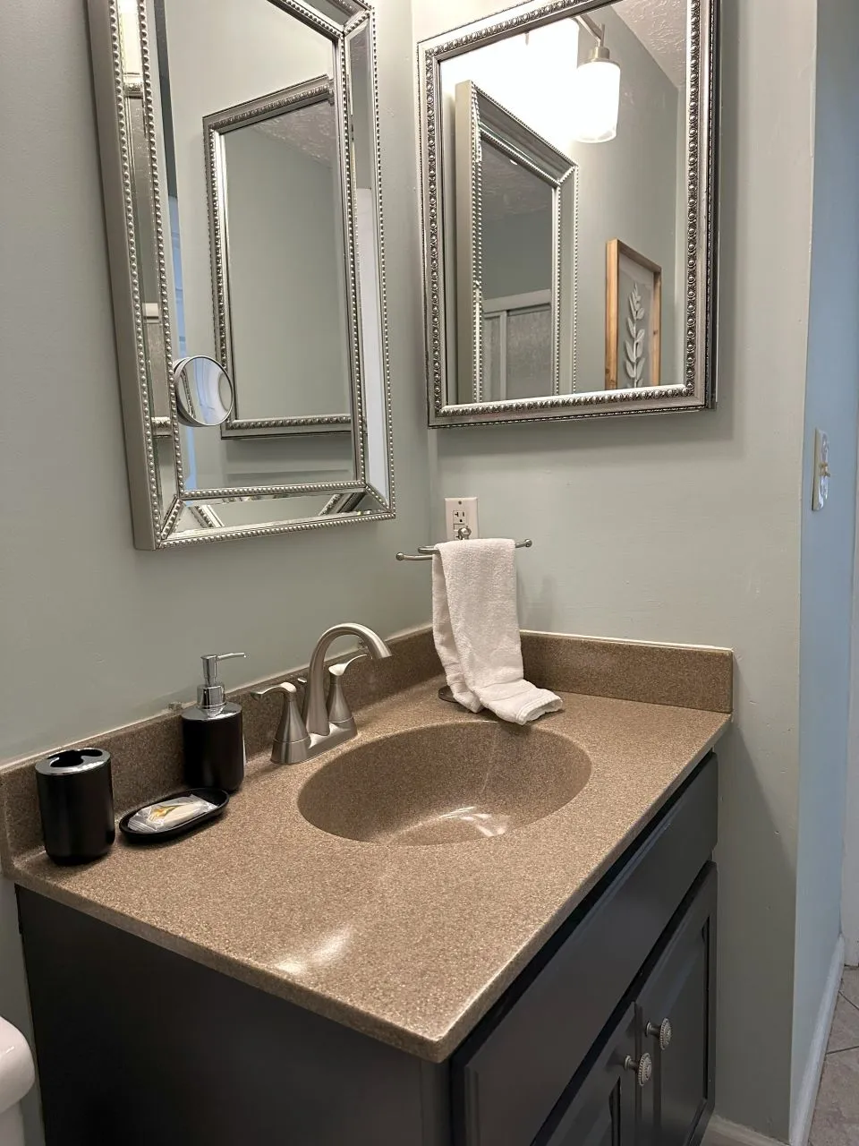 Elegant bathroom vanity with dual mirrors