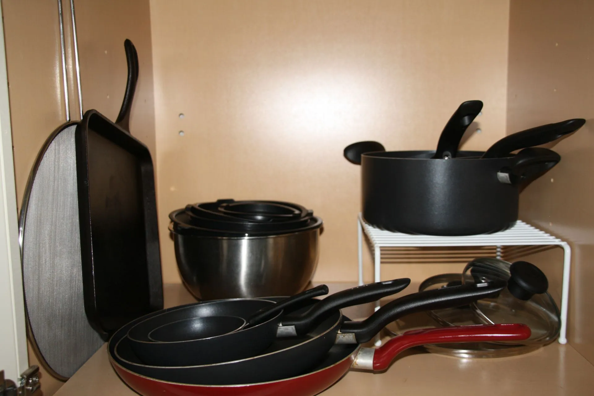 Cookware cabinet with pots and pans