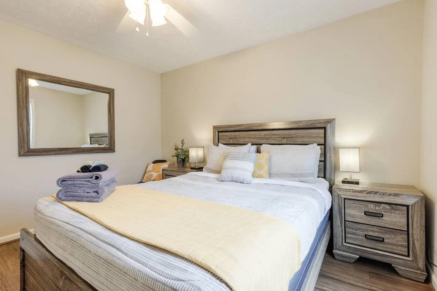 Guest bedroom bed detail with decorative pillows