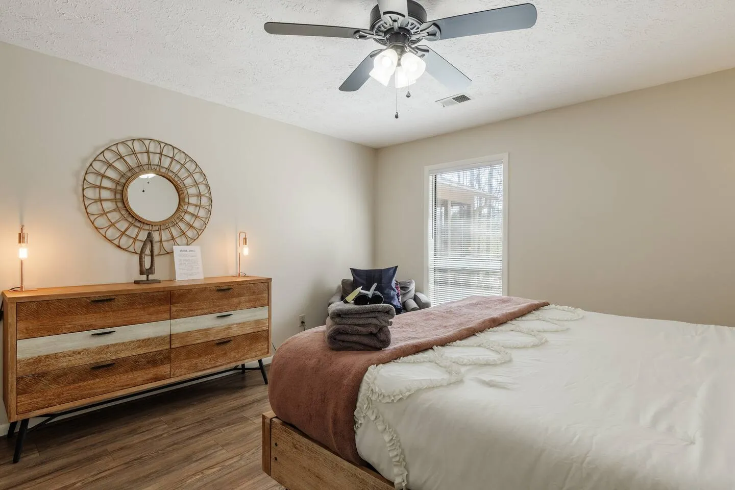 Master bedroom dresser with gold mirror