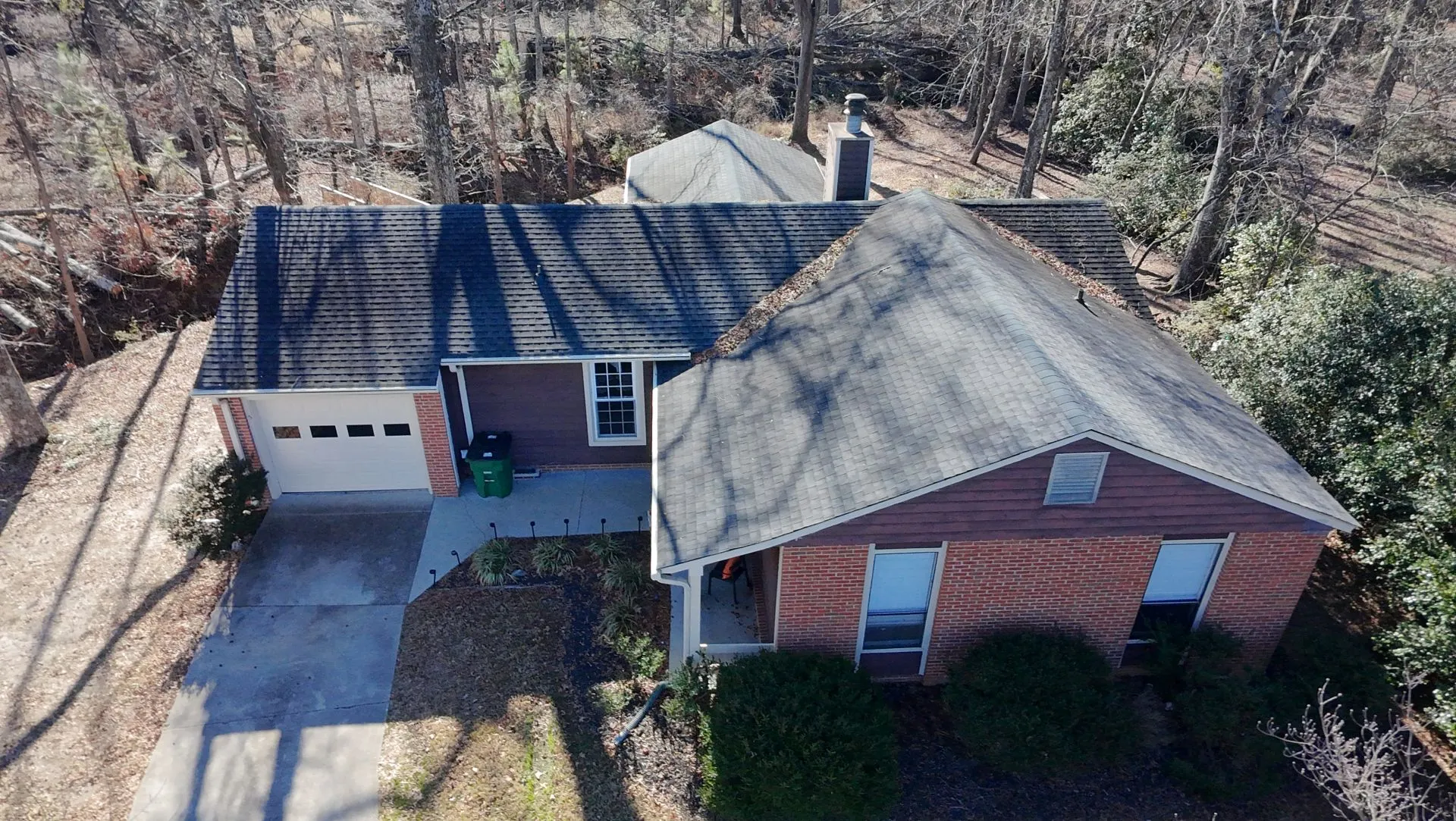 Aerial view of property nestled in forest