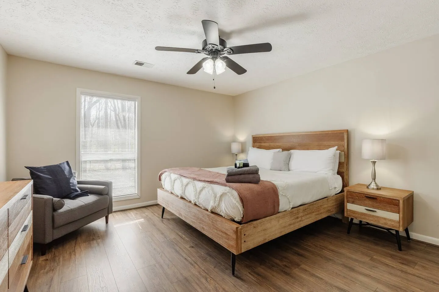 Master bedroom with queen bed and premium linens