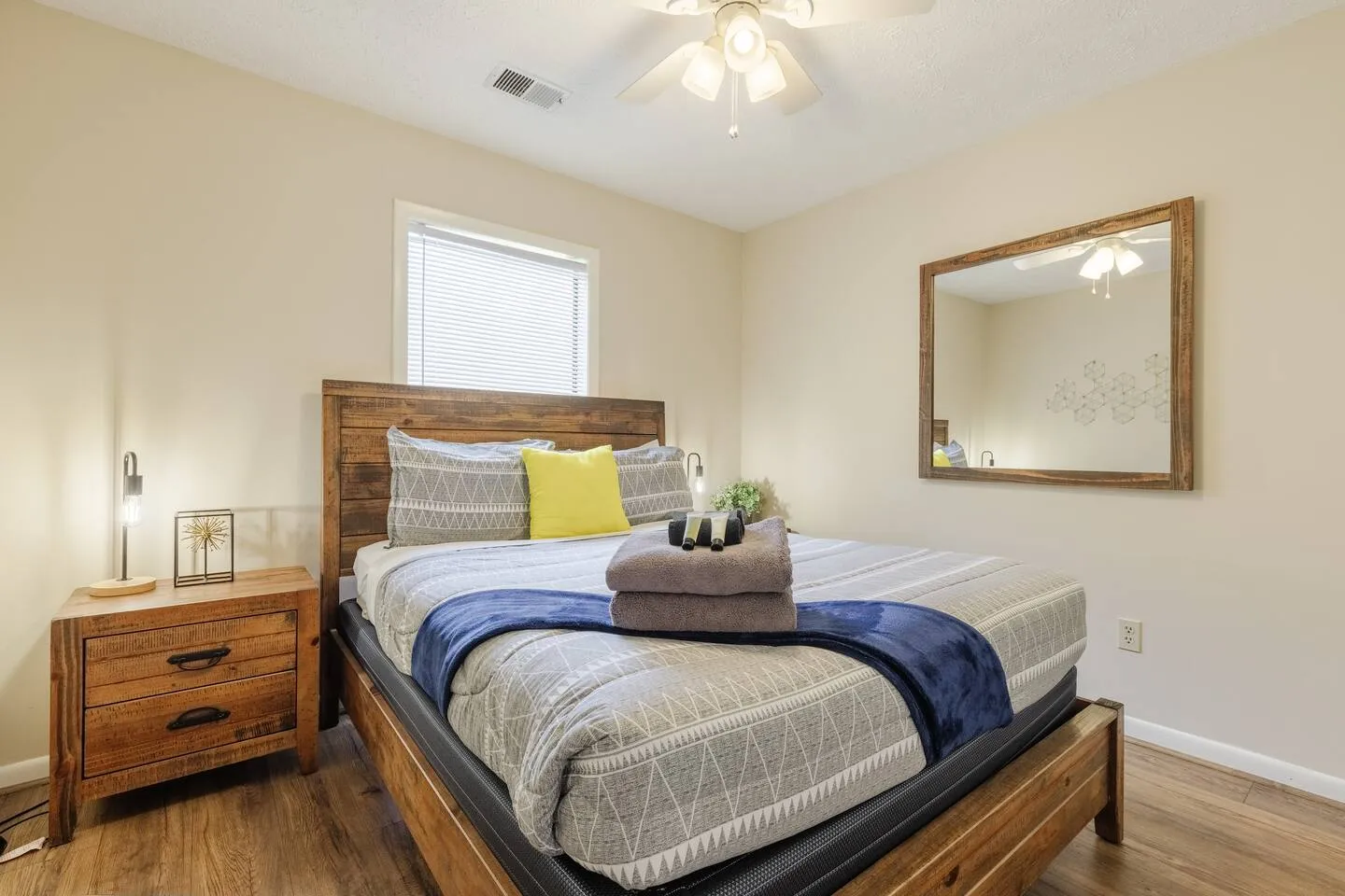 Third bedroom with rustic wood bed frame